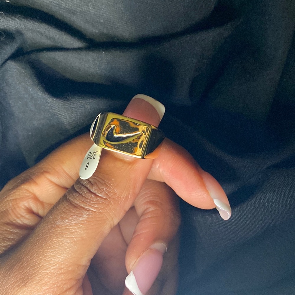 Carved “Nike” ring